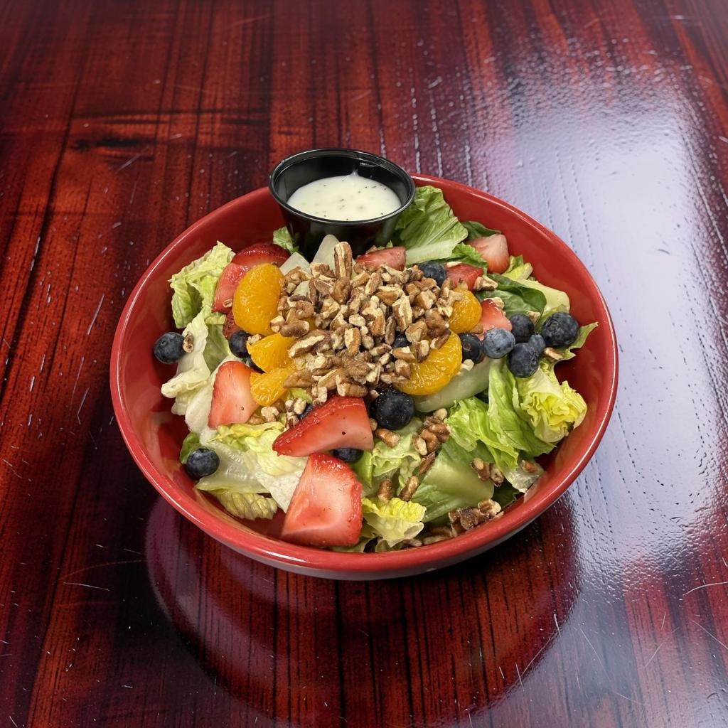 Strawberry Pecan Salad — grilled chicken, strawberries, blueberries, candied pecans and feta with warm poppy seed dressing at D'Agostino's Navajo Bar & Grille, Bridgman, Michigan