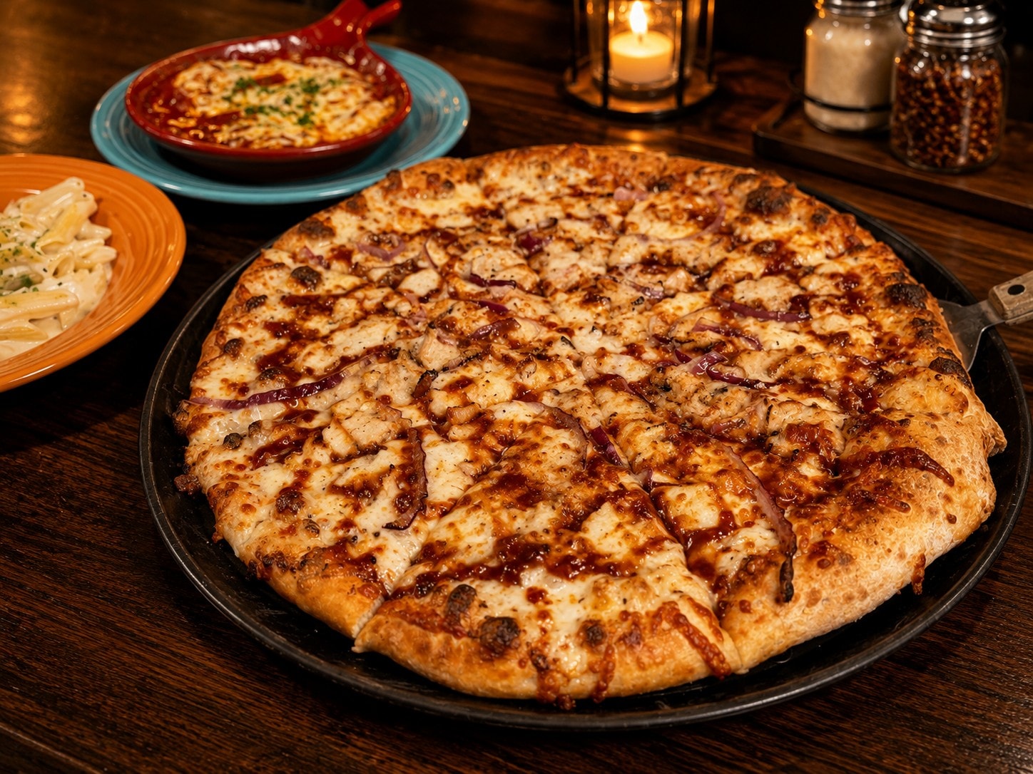 BBQ Chicken pizza — barbecue sauce, chicken, bacon, red onion, Colby Jack and mozzarella