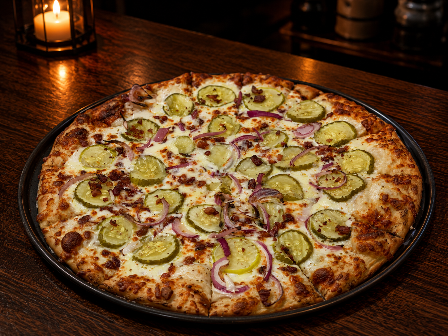 The Big Dill pizza — ranch pickle-brine sauce, dill pickles, crispy bacon, red onion
