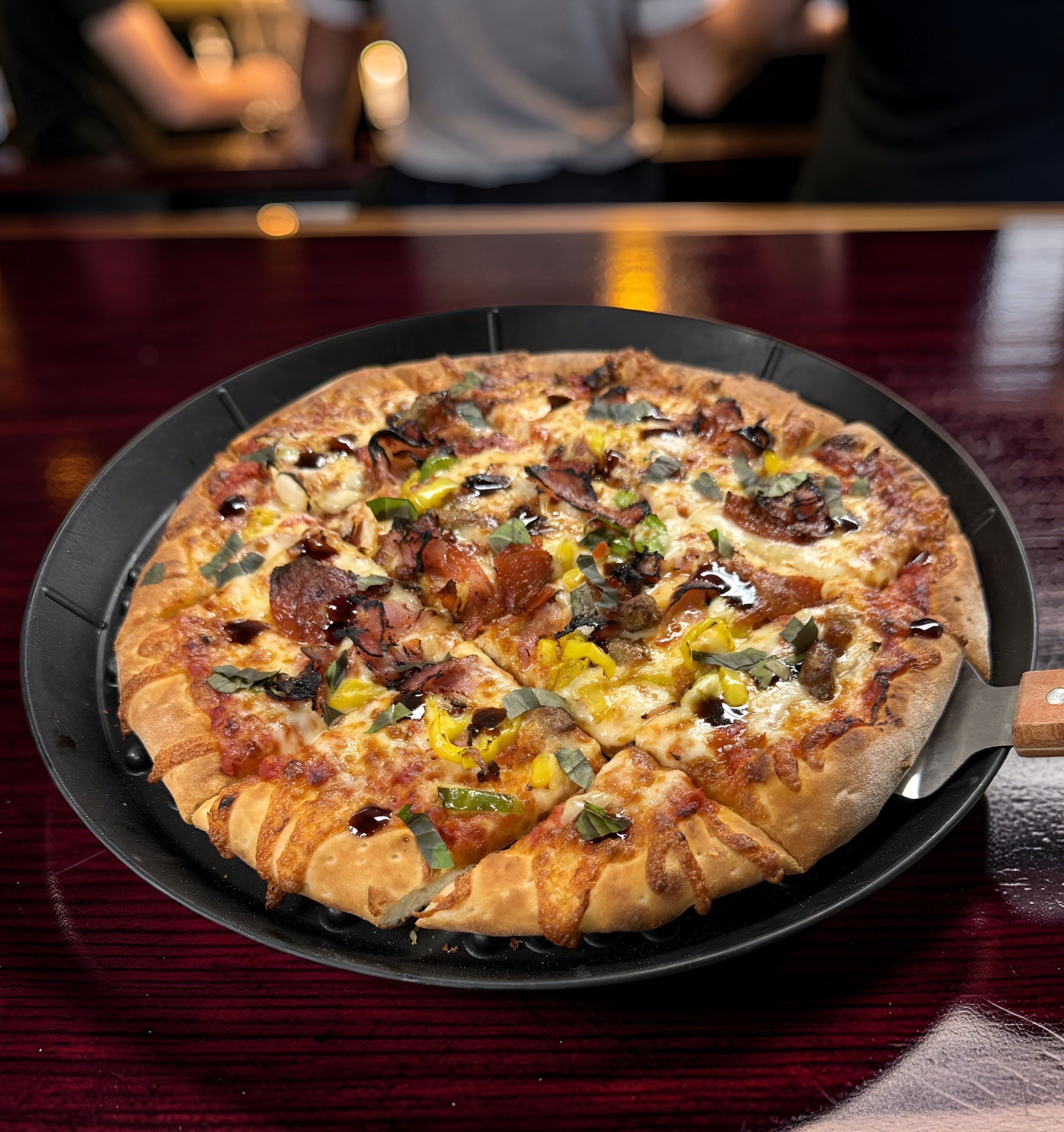 Chop Chop Supreme pizza — Italian sausage, pepperoni, ham, bacon, mushrooms, and fresh basil