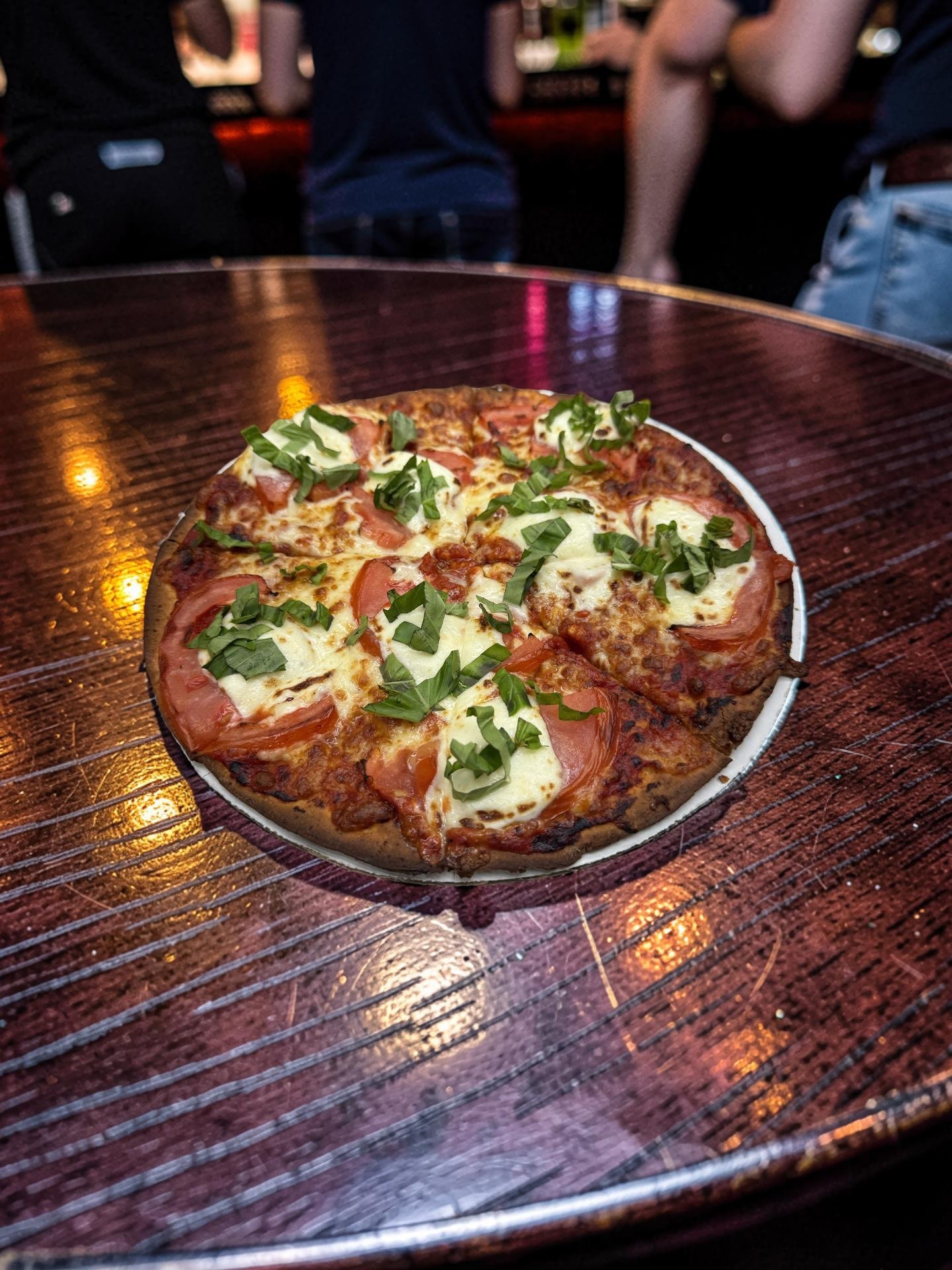 Margherita pizza — fresh mozzarella, vine-ripened tomatoes, and fragrant basil