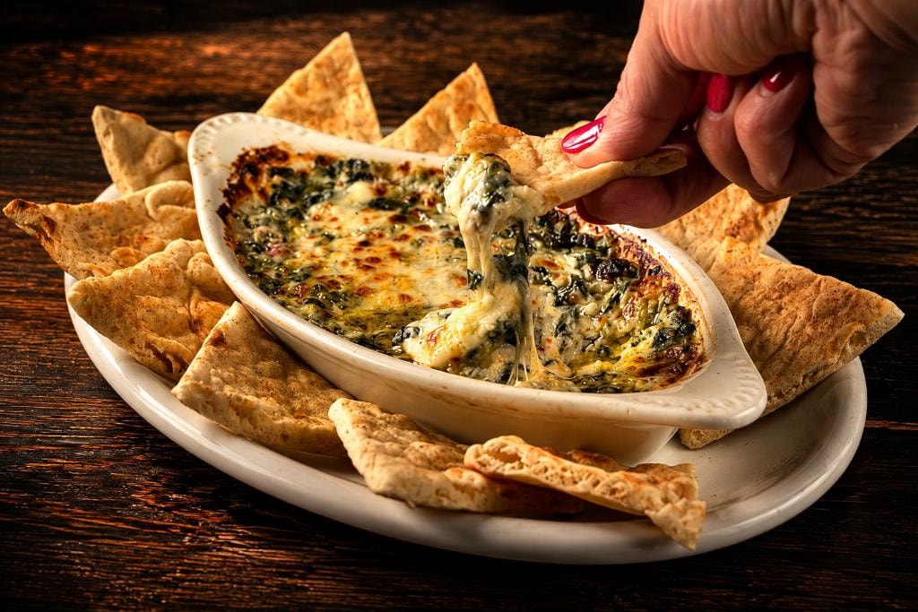Tuscan spinach dip baked hot and creamy, served with toasted pita at D'Agostino's Navajo Bar & Grille