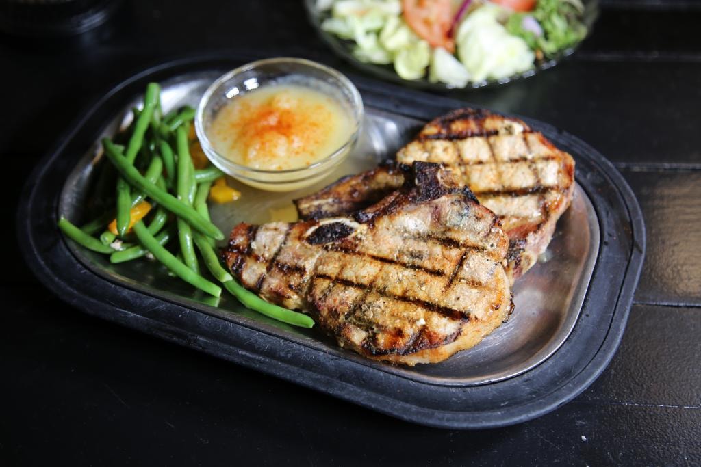 Twin bone-in pork chops grilled with green beans at D'Agostino's Navajo Bar & Grille, Bridgman, Michigan